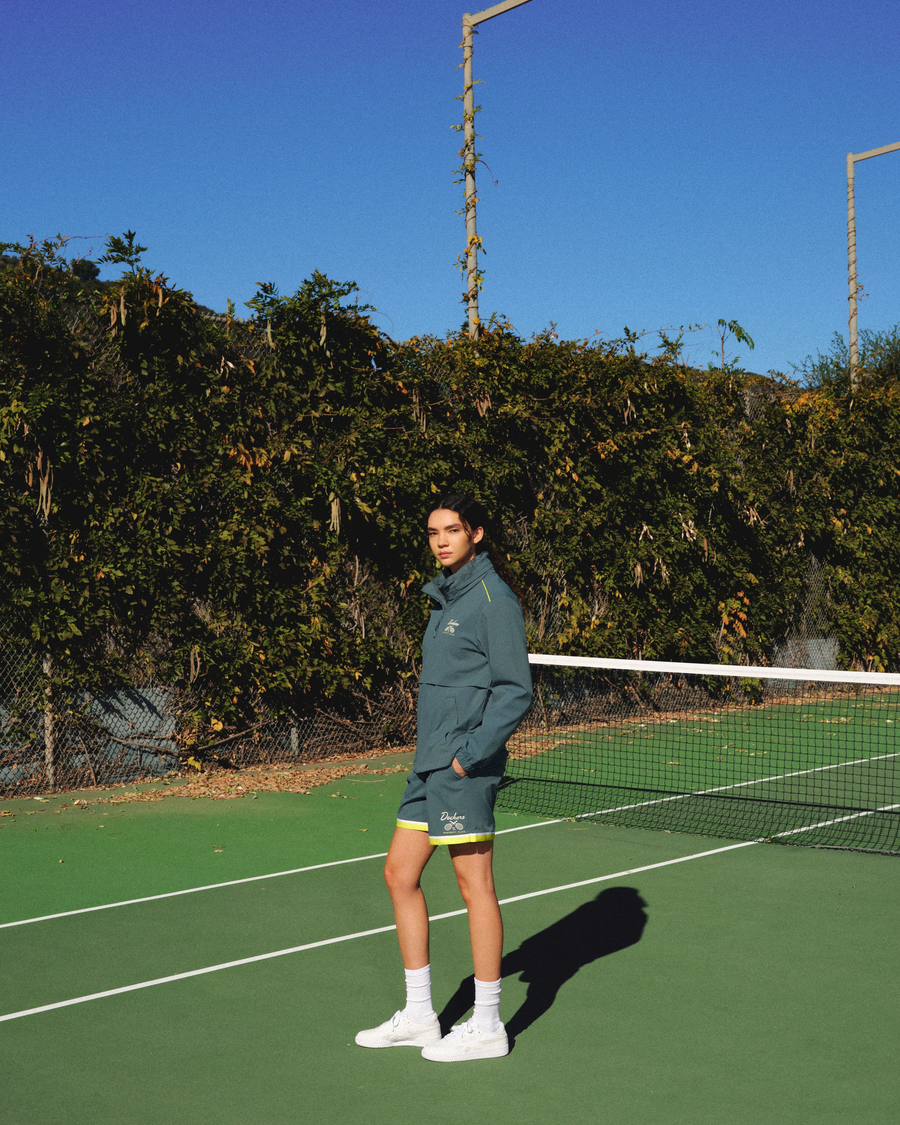 View of model wearing Green Heron Racquet Club Retro 5'5" Short, Relaxed Fit.