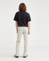 Back view of model wearing Grit Alpha Chino Pants, Slim Fit.