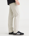 Side view of model wearing Grit Alpha Chino Pants, Slim Fit.