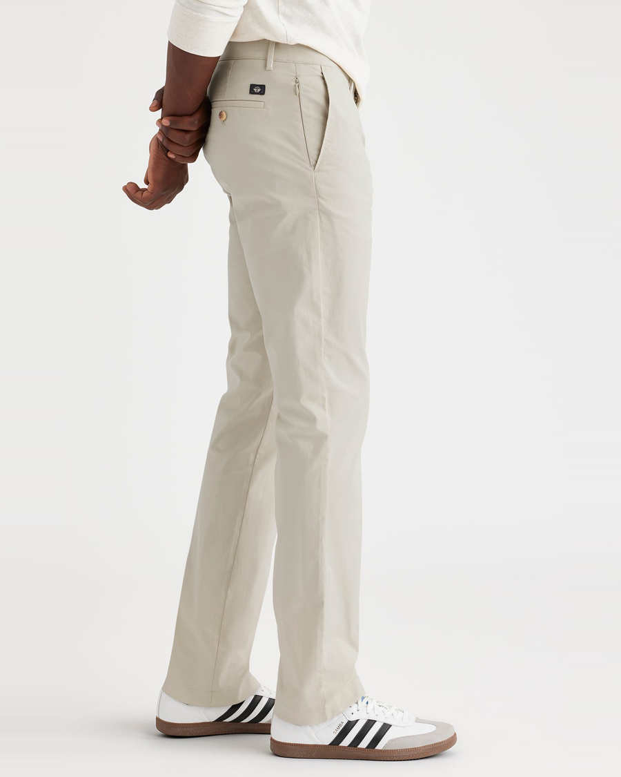 Side view of model wearing Grit Crafted Khaki Pants, Slim Fit.