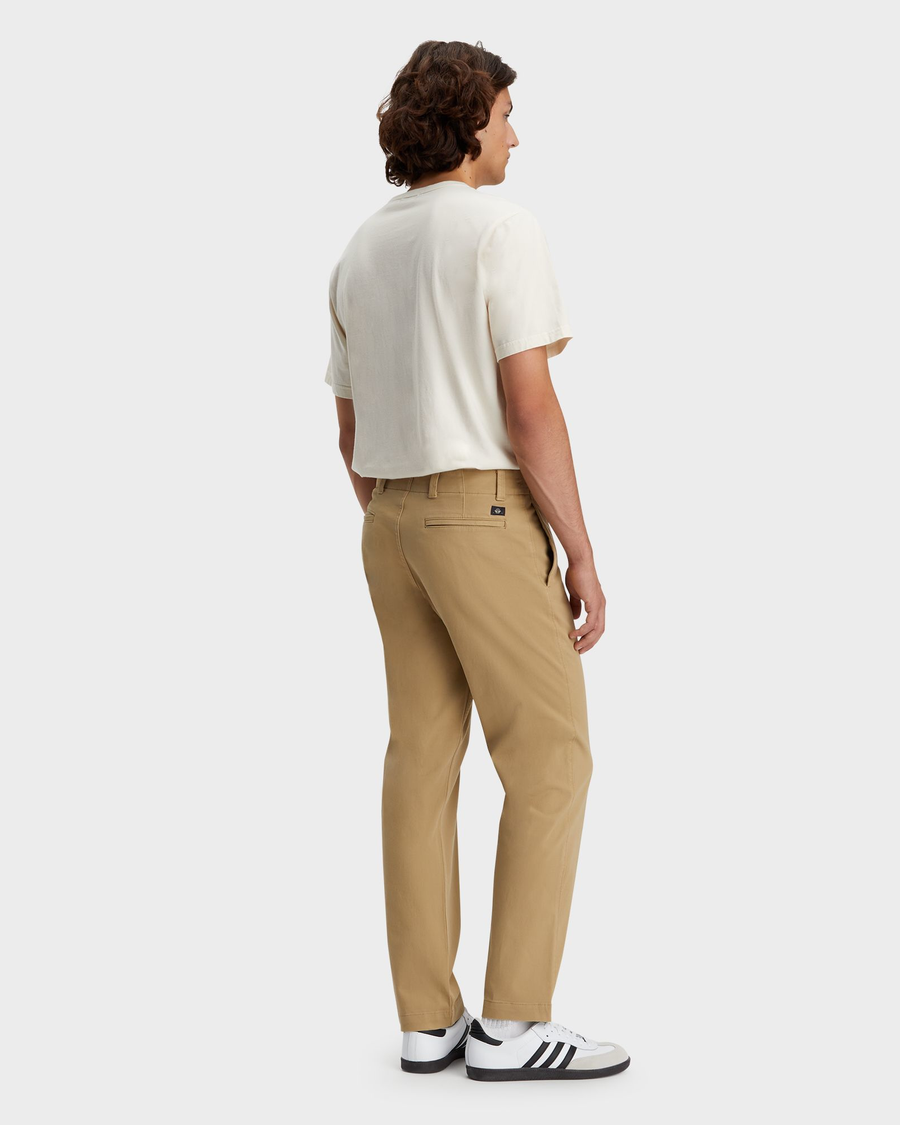 Back view of model wearing Harvest Gold Alpha Chino Pants, Straight Fit.