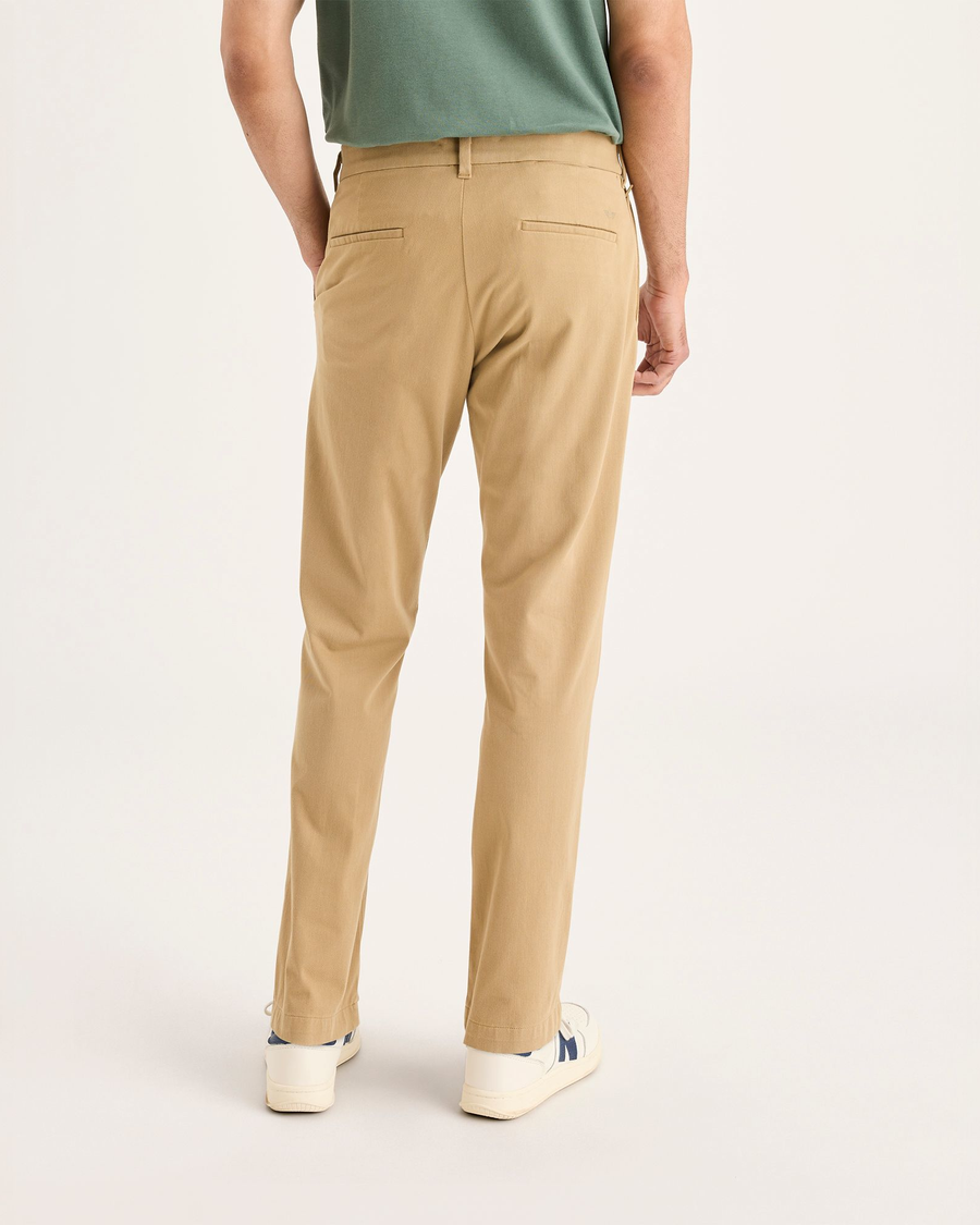 Back view of model wearing Harvest Gold Go Activeflex Chino, Slim Fit.