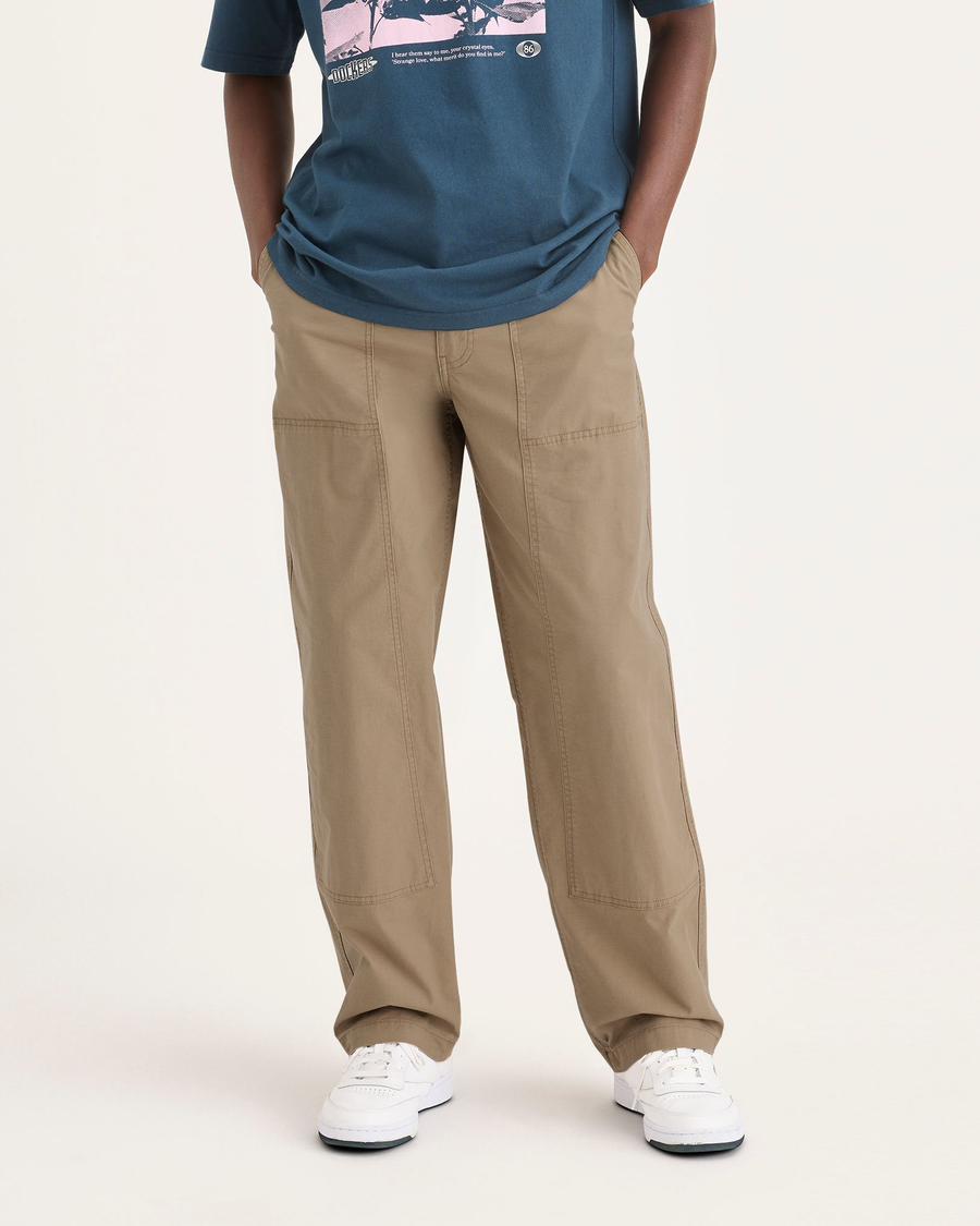 Front view of model wearing Harvest Gold Men's Loose Fit Eighty-Six Utility Pants.