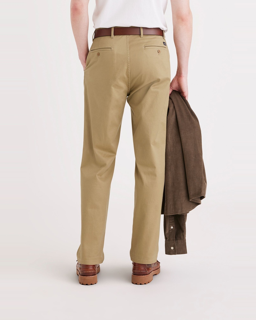 Back view of model wearing Harvest Gold Men's Relaxed Tapered Fit Original Chino Pants.