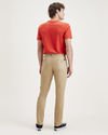 Back view of model wearing Harvest Gold Men's Skinny Fit Original Chino Pants.