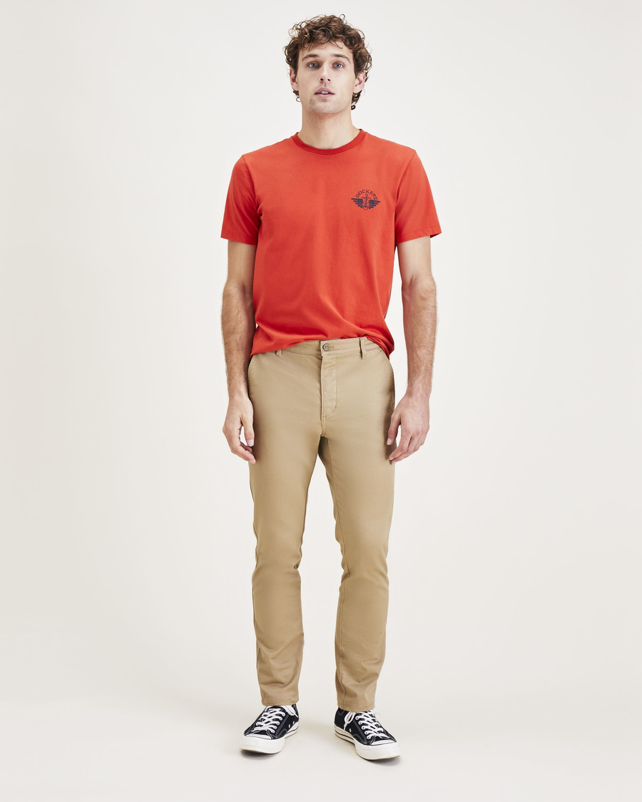 Front view of model wearing Harvest Gold Men's Skinny Fit Original Chino Pants.