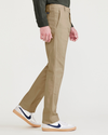 Side view of model wearing Harvest Gold Men's Slim Fit Original Chino Pants.