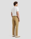 Back view of model wearing Harvest Gold Men's Straight Fit Original Chino Pants.
