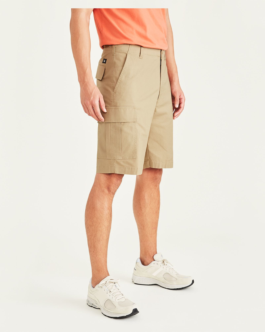 Side view of model wearing Harvest Gold Men's Straight Fit Supreme Flex Cargo Shorts.