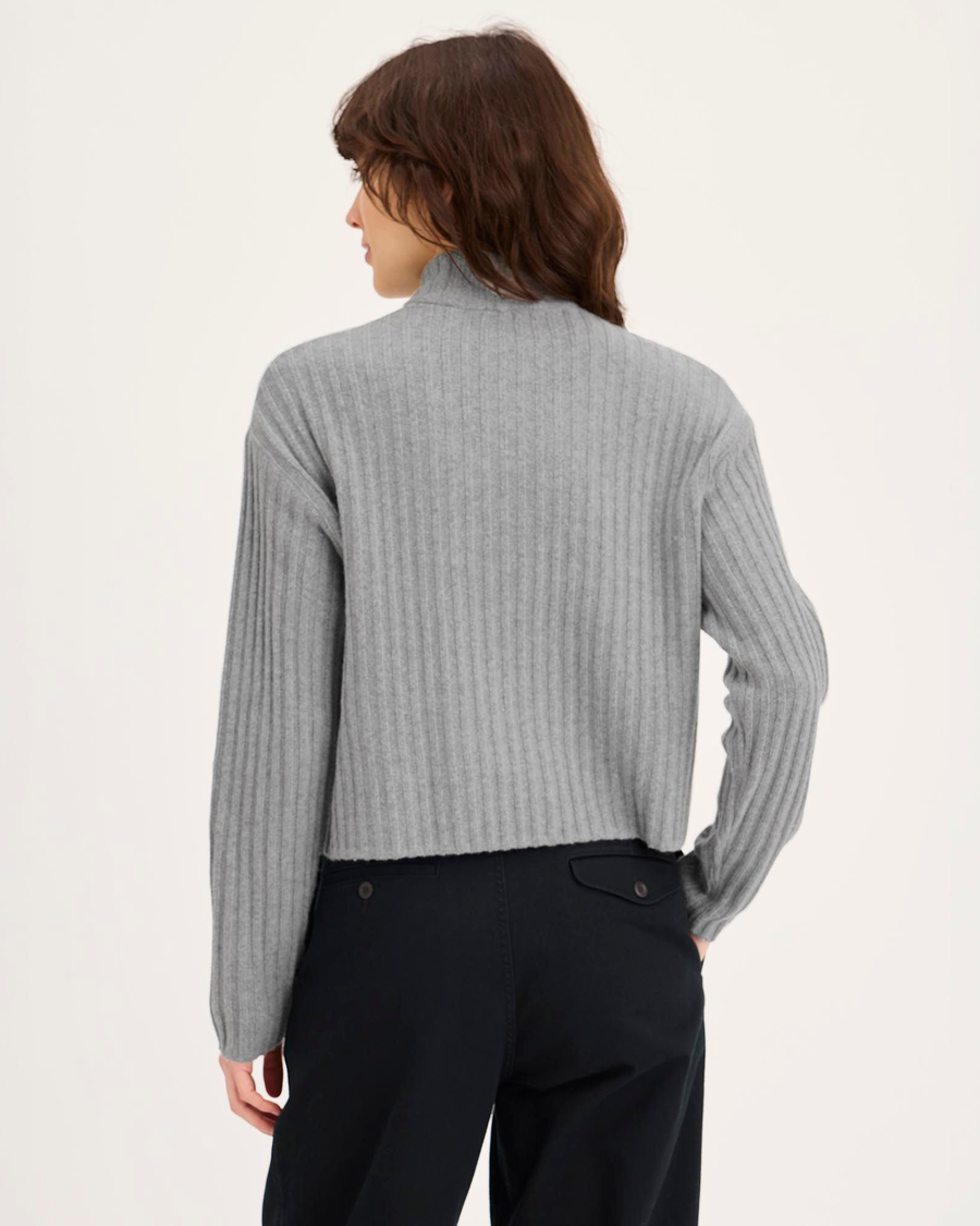 Back view of model wearing Heather Gray Mockneck Sweater, Relaxed Fit.
