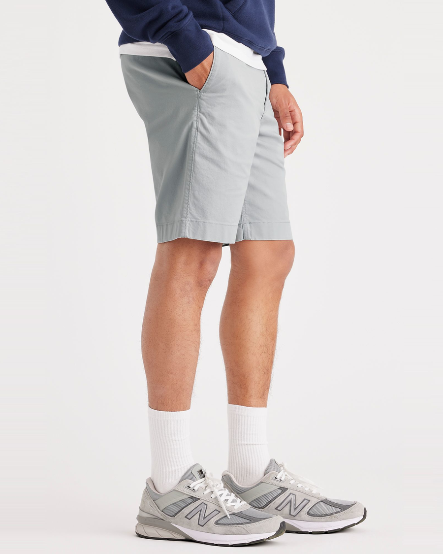 Side view of model wearing High-Rise Alpha Chino Shorts, Straight Fit.