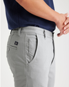View of model wearing High-Rise Men's Skinny Fit Supreme Flex Alpha Khaki Pants.