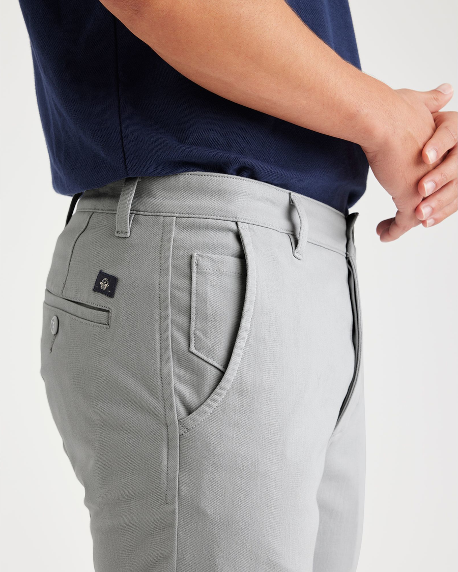 View of model wearing High-Rise Men's Skinny Fit Supreme Flex Alpha Khaki Pants.
