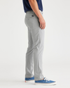 Side view of model wearing High-Rise Men's Skinny Fit Supreme Flex Alpha Khaki Pants.