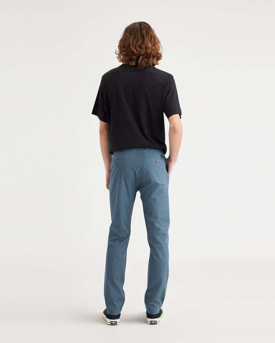 Back view of model wearing Indian Teal Crafted Khaki Pants, Slim Fit.