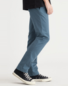 Side view of model wearing Indian Teal Crafted Khaki Pants, Slim Fit.