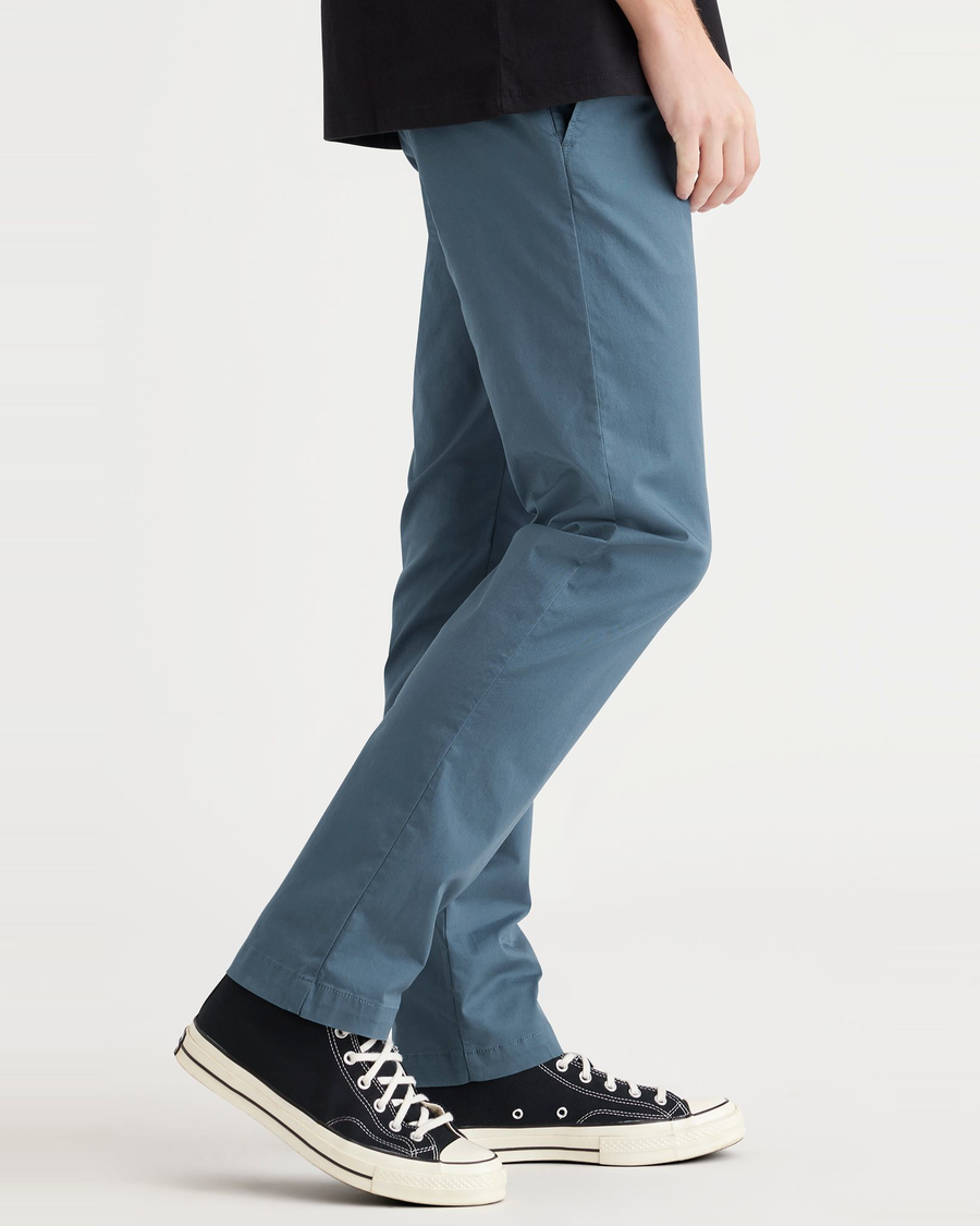 Side view of model wearing Indian Teal Crafted Khaki Pants, Slim Fit.