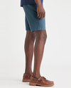 Side view of model wearing Indian Teal Men's Supreme Flex Modern Chino Short.