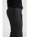 Side view of model wearing Jubilee Asphalt Men's Slim Tapered Fit Refined Pull-On Pants.