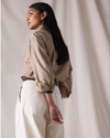 Back view of model wearing Khaki Chambray Dockers® x Transnomadica Dock Shirt.