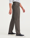 Side view of model wearing Khaki Green Men's Slim Fit Smart 360 Flex Alpha Chino Pants.