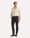 View of model wearing Licorice Crafted Khaki Pants, Slim Tapered Fit.