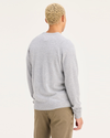 Back view of model wearing Light Heather Grey Men's Regular Fit Crafted Cashmere Sweater.