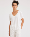 Front view of model wearing Lucent White Deep V-Neck Tee, Regular Fit.