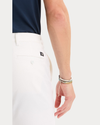 View of model wearing Lucent White Original Chino Pants, Slim Fit.