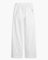 View of model wearing Lucent White Women's Drawstring Pants.