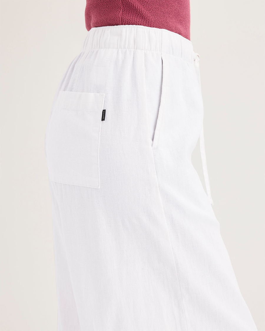 Side view of model wearing Lucent White Women's Drawstring Pants.