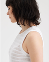 View of model wearing Lucent White Women's Sweater Tank.