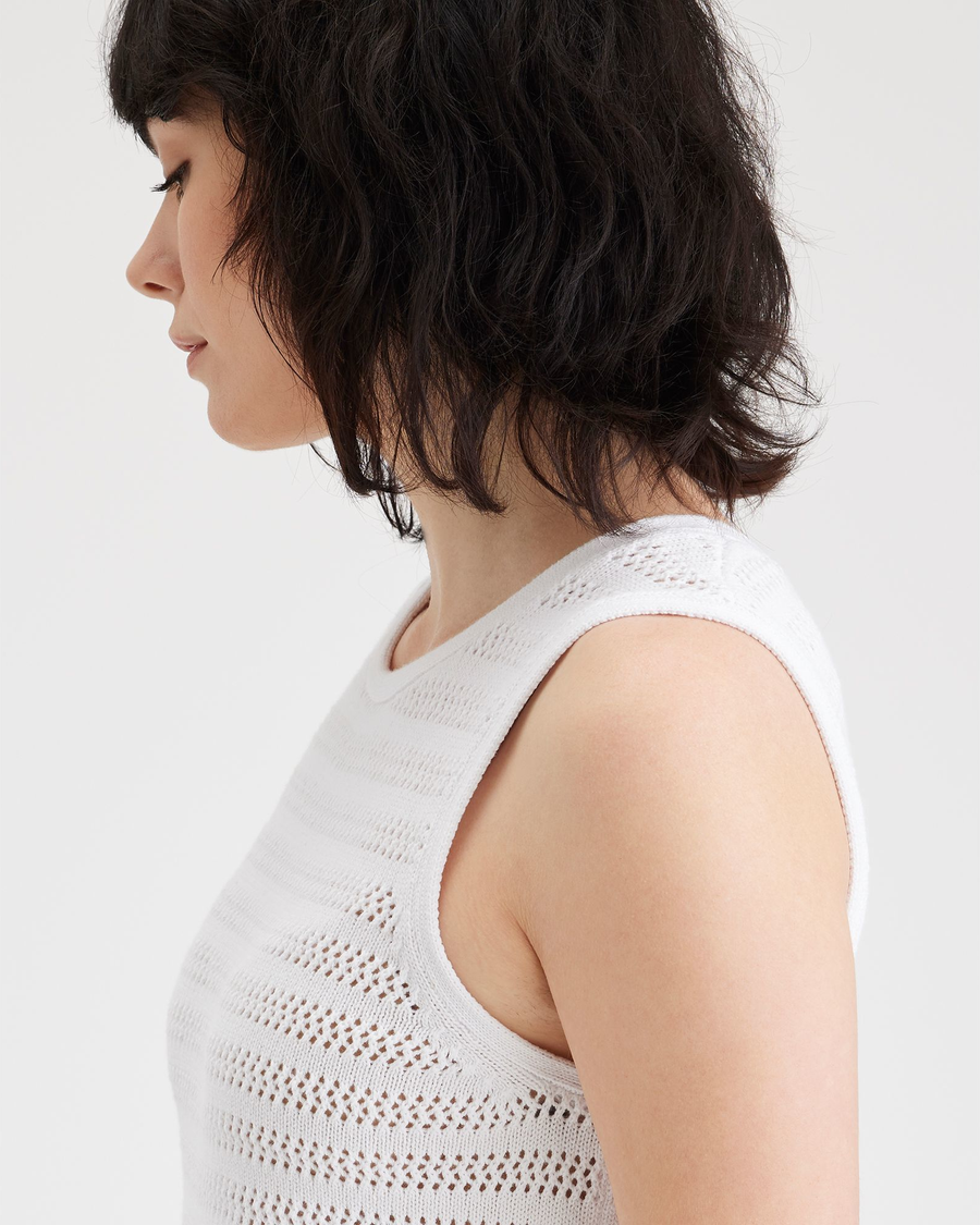 View of model wearing Lucent White Women's Sweater Tank.