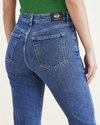 View of model wearing Medium Indigo Stonewash Women's Slim Fit High Jean Cut Pants.