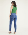 Back view of model wearing Medium Indigo Stonewash Women's Slim Fit High Jean Cut Pants.