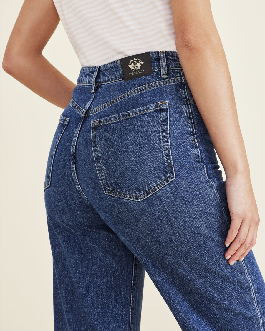 View of model wearing Medium Indigo Stonewash Women's Straight Fit High Jean Cut Pants.