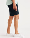 Side view of model wearing Navy Blazer Alpha Chino Shorts, Straight Fit.