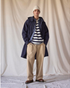 View of model wearing Navy Blazer Dockers® x Transnomadica Squall Coat.