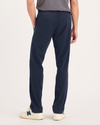 Back view of model wearing Navy Blazer Go Activeflex Pull-On Pant, Slim Fit.