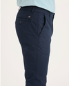 Side view of model wearing Navy Blazer Men's Skinny Fit Original Chino Pants.