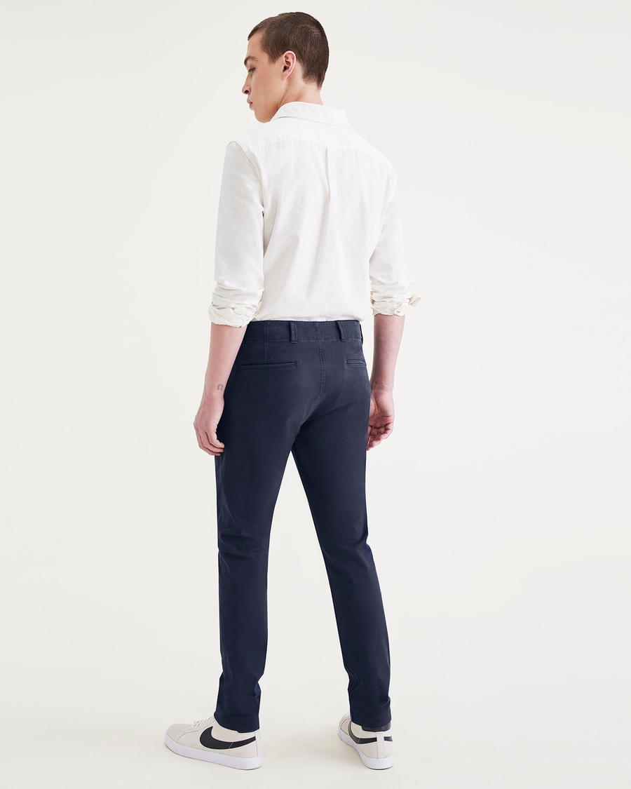 Back view of model wearing Navy Blazer Men's Skinny Fit Smart 360 Flex California Chino Pants.