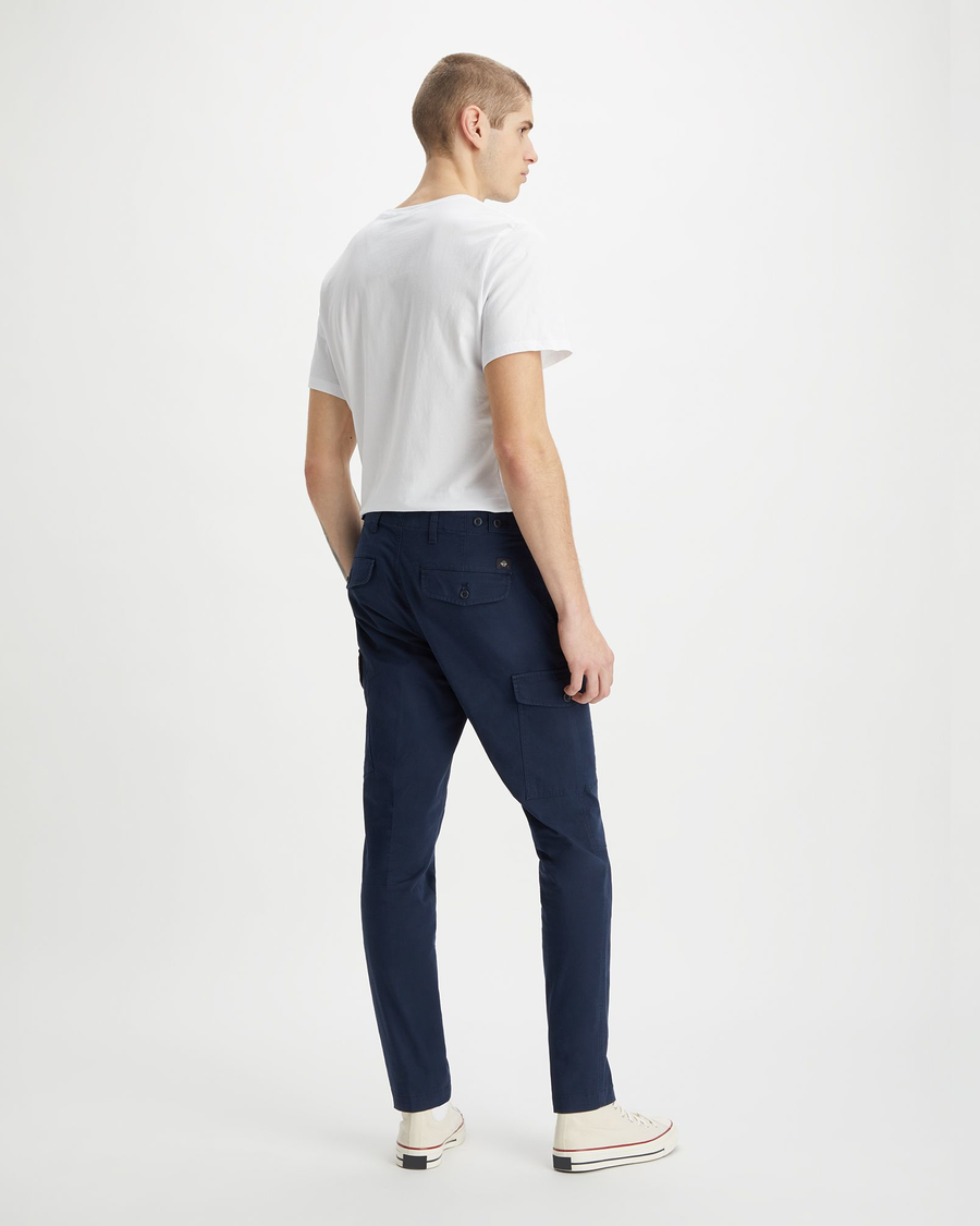Back view of model wearing Navy Blazer Men's Slim Tapered Fit Cargo Pants.