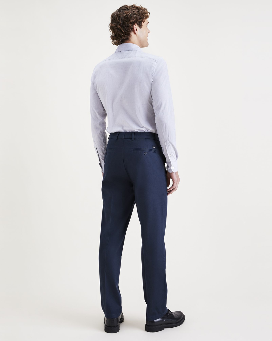 Back view of model wearing Navy Blazer Signature Iron Free Khakis, Creased, Slim Fit with Stain Defender®.