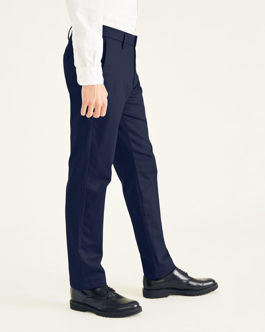 Side view of model wearing Navy Blazer Signature Iron Free Khakis, Creased, Slim Fit with Stain Defender®.