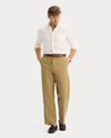 View of model wearing New British Khaki Eighty-Six Original Chino Pants, Loose Fit.