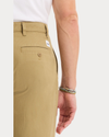 View of model wearing New British Khaki Eighty-Six Original Pleated Chinos, Loose Fit.