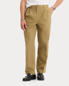 Front view of model wearing New British Khaki Eighty-Six Original Pleated Chinos, Loose Fit.
