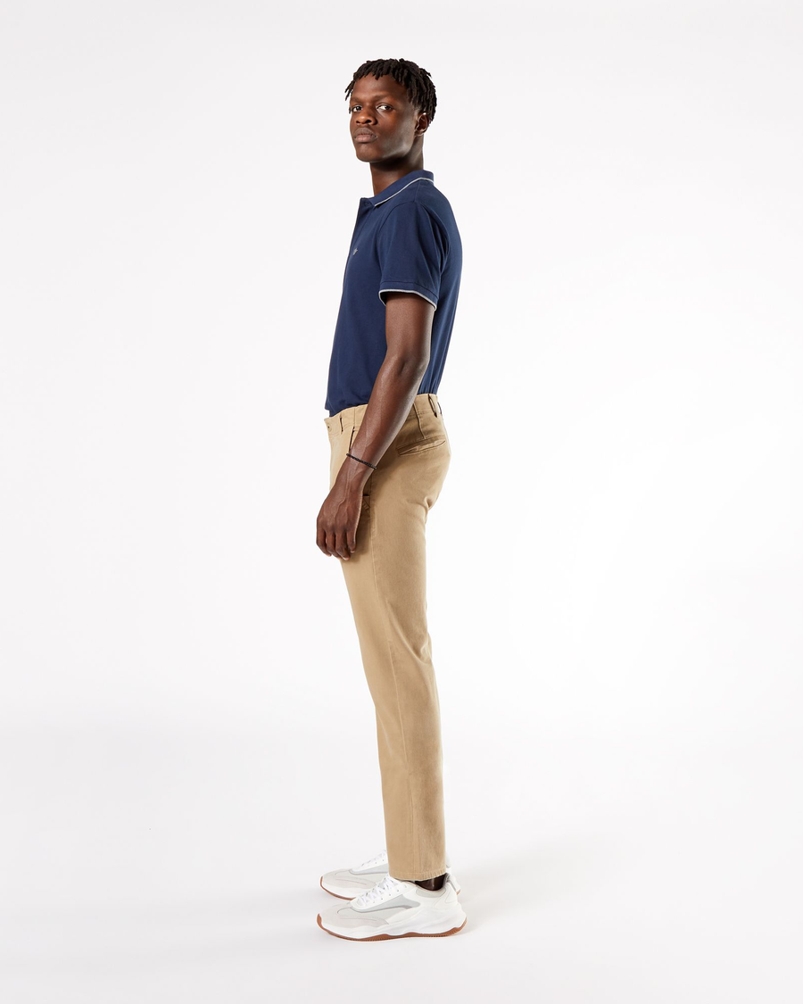Side view of model wearing New British Khaki Men's Slim Fit Smart 360 Flex Alpha Khaki Pants.