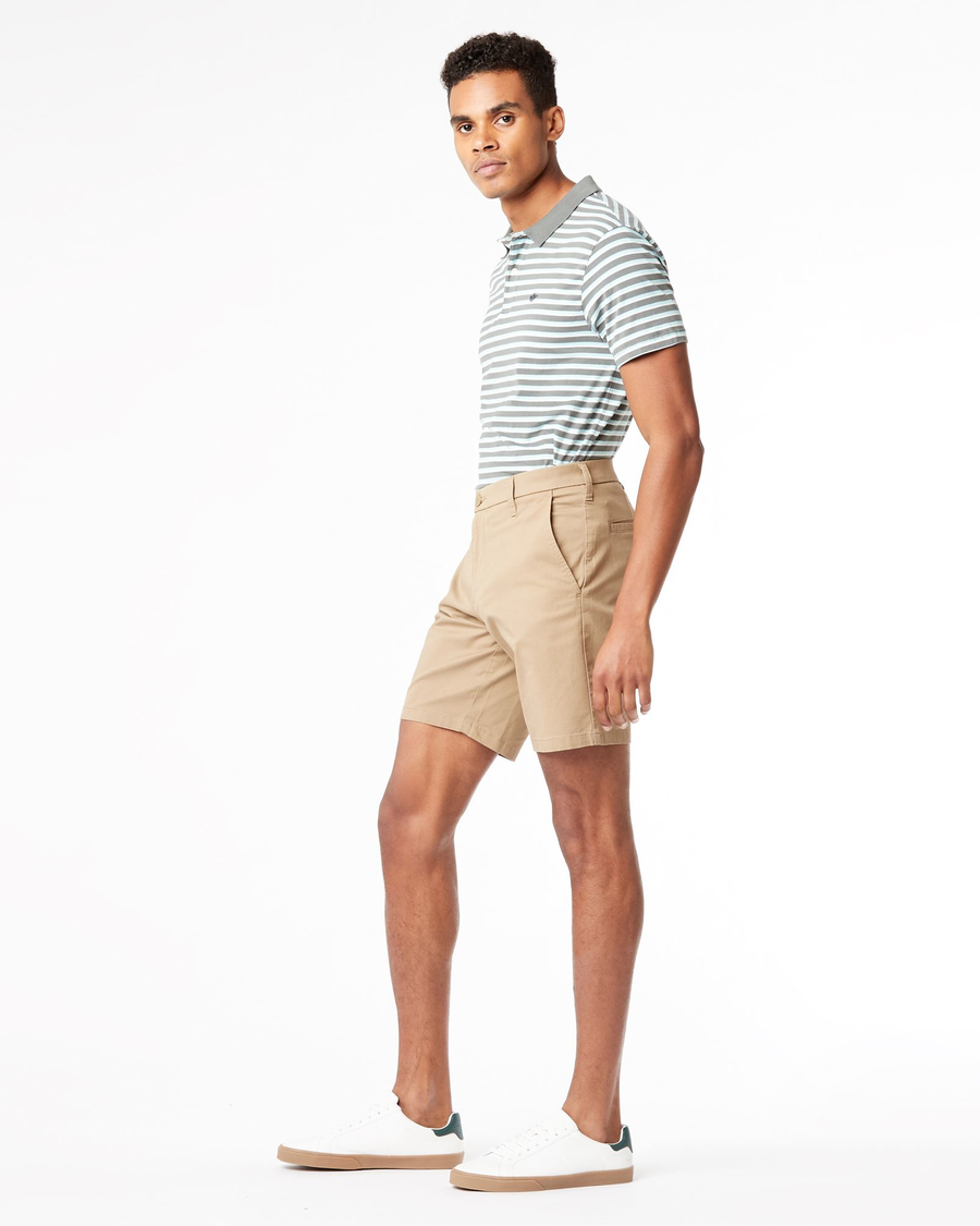 Side view of model wearing New British Khaki Men's Straight Fit Ultimate Shorts.