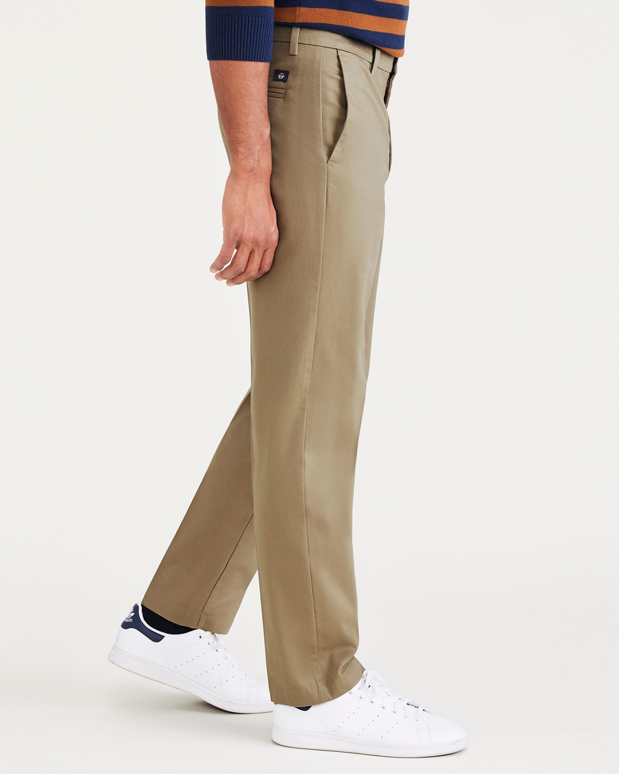 Side view of model wearing New British Khaki Signature Iron Free Khakis, Creased, Slim Fit with Stain Defender®.